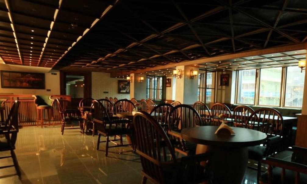 Coffee Shop interior with dark wood furniture